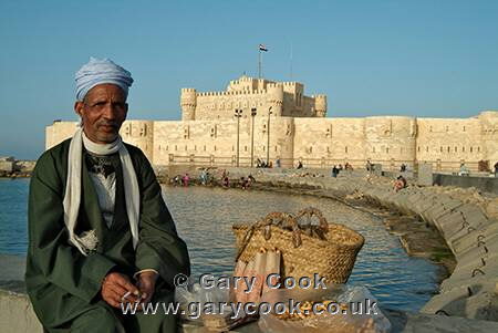 Egyptian man selling peanuts at the Fortress of Qaitbey, Alexandria, Egypt