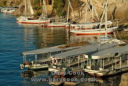 Ferry boats and feluccas on the river Nile, Aswan, Egypt
