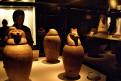 Visitor looking at coptic jars, Mummification Museum, Luxor, Egypt