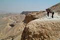 Tourists walking along the cliffs above the Valley of the Knigs, Luxor, Egypt