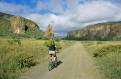 Tourist cycling through Hells Gate National Park, Kenya