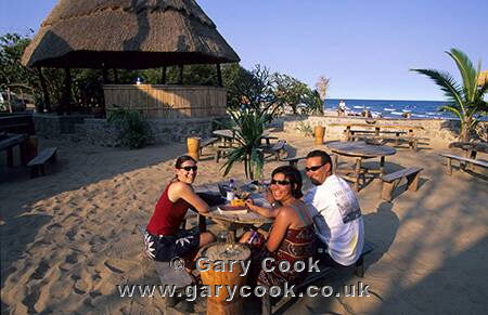 Group enjoying the bar, Kande Beach, Malawi