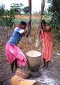 Women pounding cassava, Kande, Malawi