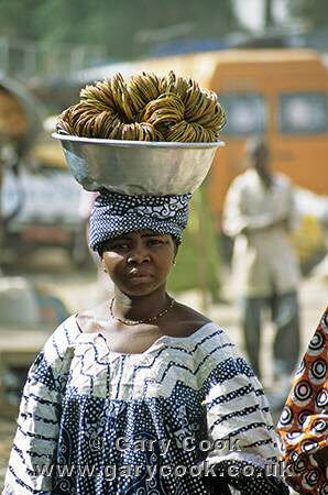Local woman carrying produce to market, Djenne, Mali