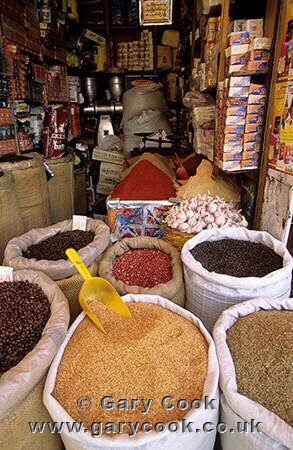 Beans, spices, garlic etc for sale, typical shop in the medina, Morocco