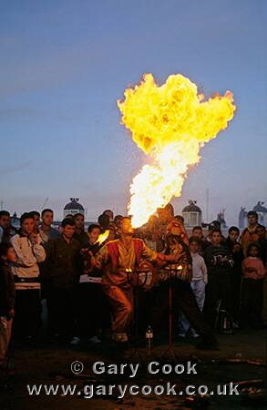 Fire-eater performing in the Place Djemaa el Fna, Marrakesh, Morocco