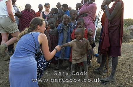 Tourist meeting the Maasai children, Tanzania