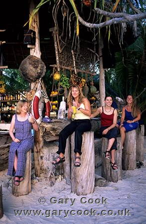 Group enjoying a drink at a beach bar, Nungwi, Zanzibar, Tanzania