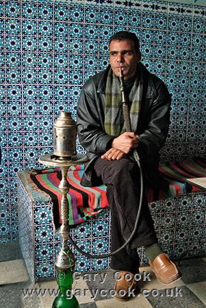 Man smoking the sheesha pipe in a cafe, Kairouan, Tunisia