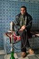 Man smoking the sheesha pipe in a cafe, Kairouan, Tunisia