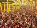 People enjoying themselves in a beer tent at the Oktoberfest, Munich, Bavaria, Germany