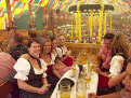 People enjoying themselves in a beer tent at the Oktoberfest, Munich, Bavaria, Germany