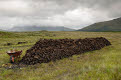 Cut peat stacked up for winter, Connemara, County Galway, Ireland