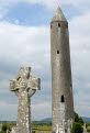 Kilmacdaugh Round Tower and celtic style cross, near Gort, County Galway, Ireland