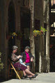 Local women chatting and knitting, Pienza, Tuscany, Italy