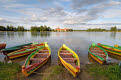 Colourful rowing boats and Trakai Castle, Trakai, near Vilnius, Lithuania