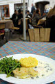 Meal in a street cafe, Butter Fish with yellow rice and sour cream sauce, Vilnius, Lithuania