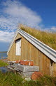 Turf roofed wooden hut, Kvaloya island, west of Tromso, Norway
