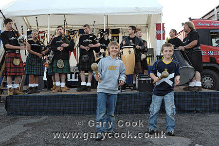 Boys enjoying The Dangleberries, Galloway Pipe Rock Band performing at Gatehouse of Fleet Gala, Dumfries and Galloway, Scotland