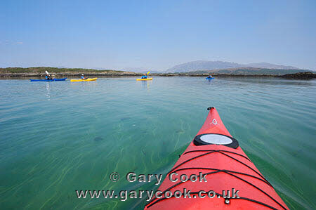 Sea kayaking near Arisaig, Highlands, Scotland