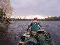 Cold wet morning, canoeing on Malberg Lake, Boundary Waters Canoe Area Wilderness, Superior National Forest, Minnesota, USA