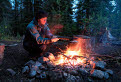 Bob cooking on the campfire near the 30mile narrows section, Teslin River, Yukon, Canada