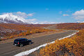 Driving along the Dempster Highway near North Fork Pass, Tombstone Provincial Park in autumn, Yukon, Canada