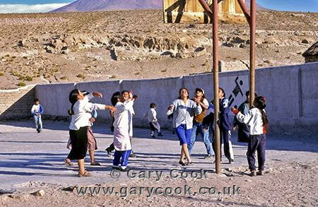 Indian girls enjoy a game of basketball, San Agustine, Altiplano, Bolivia