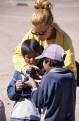Local kids fasinated by a tourists camera, Pueblo Alota, Altiplano, Bolivia