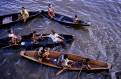 Amazonian Indians in their canoe, river Amazon, Brazil