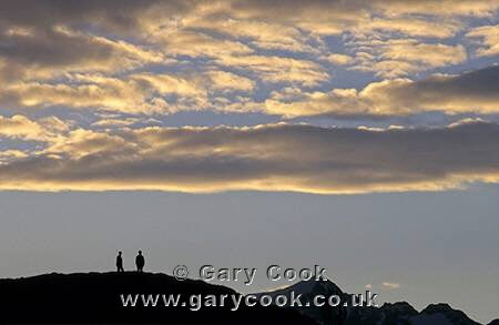 Walkers enjoying the sunset over Torres del Paine National Park, Patagonia, Chile