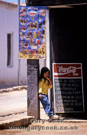 Young Indian girl enjoys an icecream, San Pedro de Atacama, Chile