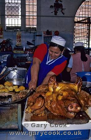 Roast pork for sale, Plaza Civica market, Cuenca, Ecuador