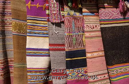 Traditional rugs for sale, craft market, Aguas Calientes, Peru