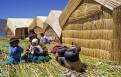 Uros Indian family on the reed islands, Lake Titicaca, Peru