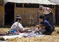 Tourists shopping for souvenirs, Uros Indians reed islands, Lake Titicaca, Peru