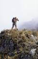 Tourist taking a well earned rest, Runkurakay Pass, Inca Trail, Peru